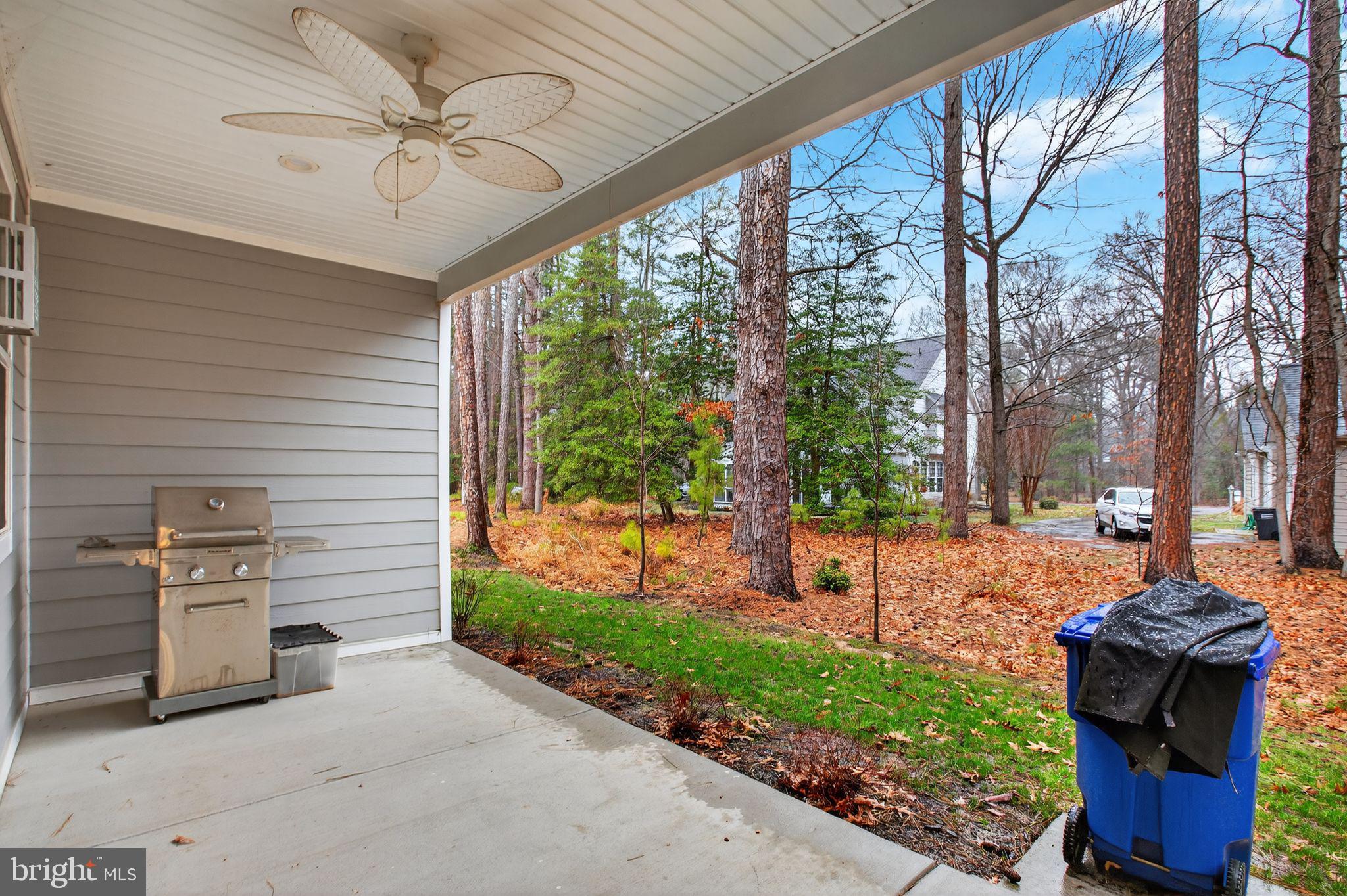 14730 Locust Court Swan Point, MD 20645 - Photo 28 of 30 a view of a porch with furniture and a yard