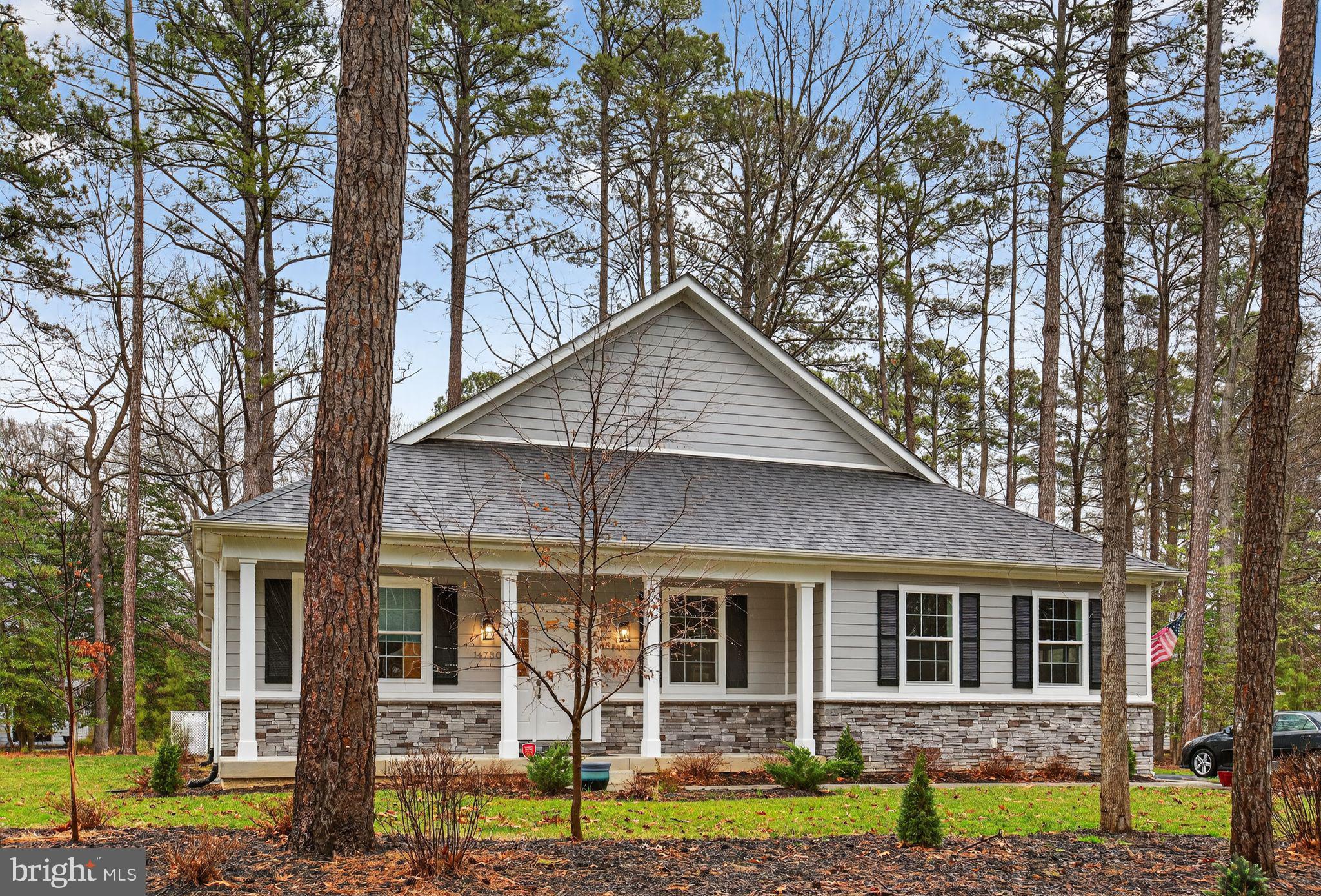 14730 Locust Court Swan Point, MD 20645 - Photo 37 of 38 a front view of a house with garden
