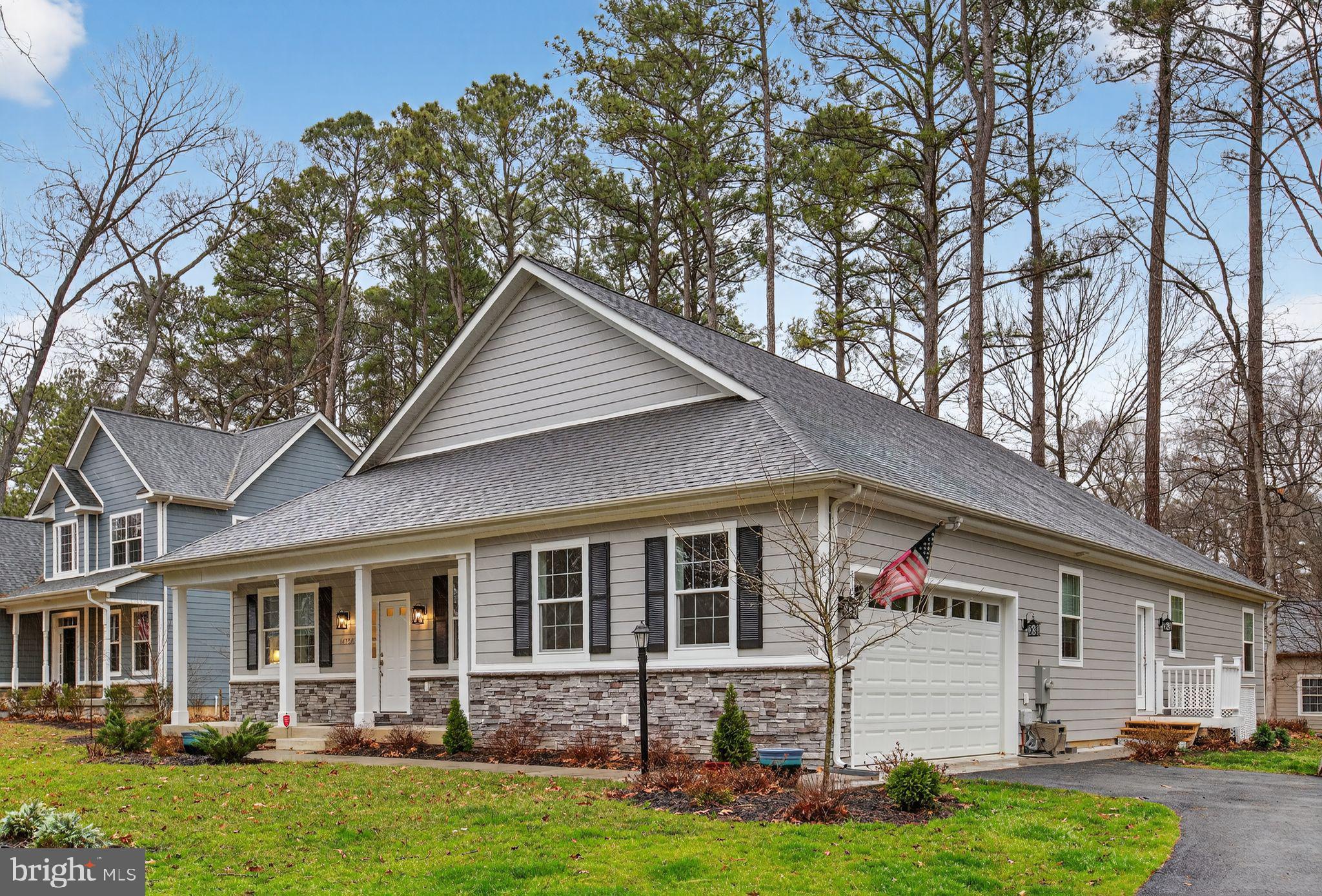 14730 Locust Court Swan Point, MD 20645 - Photo 4 of 38 a front view of a house with a yard