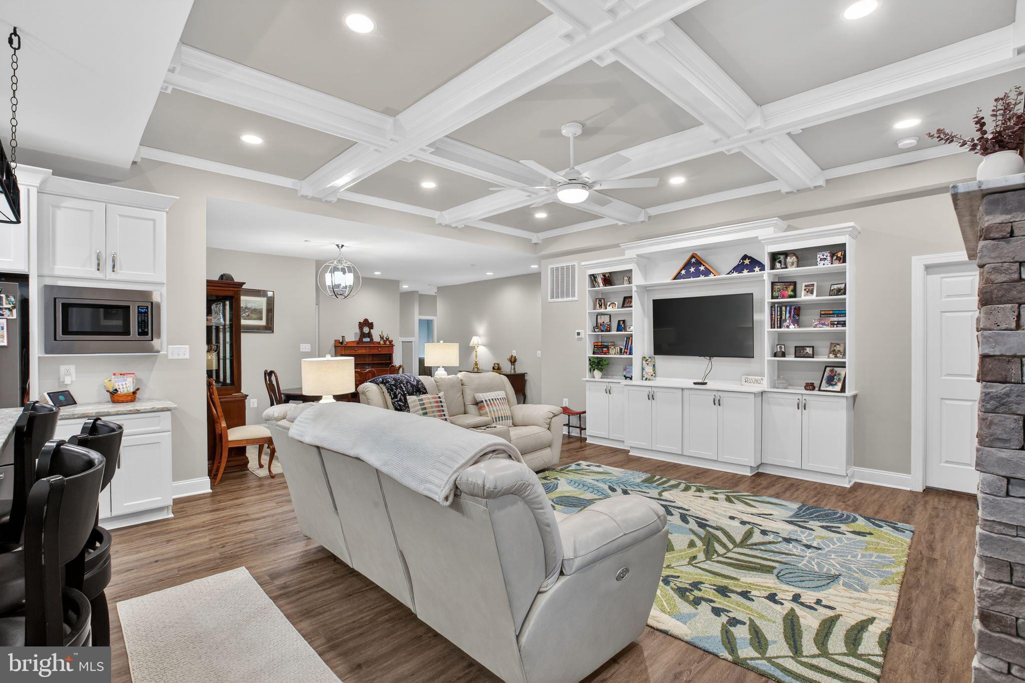 14730 Locust Court Swan Point, MD 20645 - Photo 8 of 30 a living room with furniture and a flat screen tv