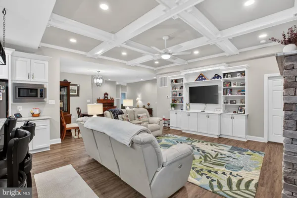 a open kitchen with stainless steel appliances granite countertop a stove and a refrigerator