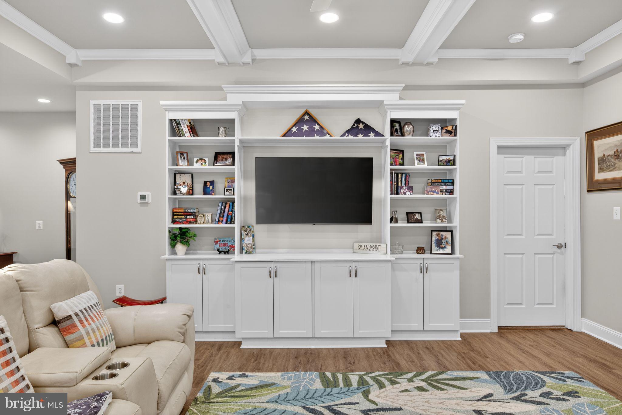 14730 Locust Court Swan Point, MD 20645 - Photo 10 of 30 a living room with furniture and a flat screen tv