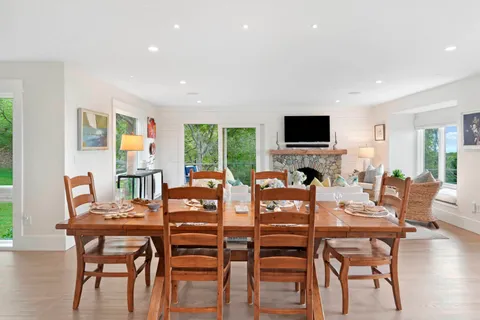 a view of a dining room with furniture window and wooden floor