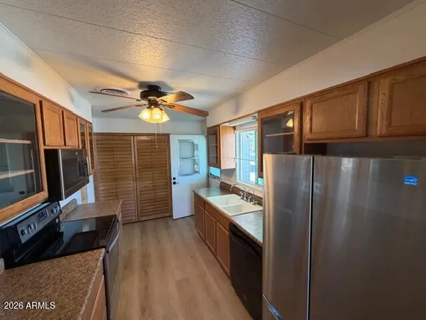 a kitchen with stainless steel appliances a refrigerator and a sink