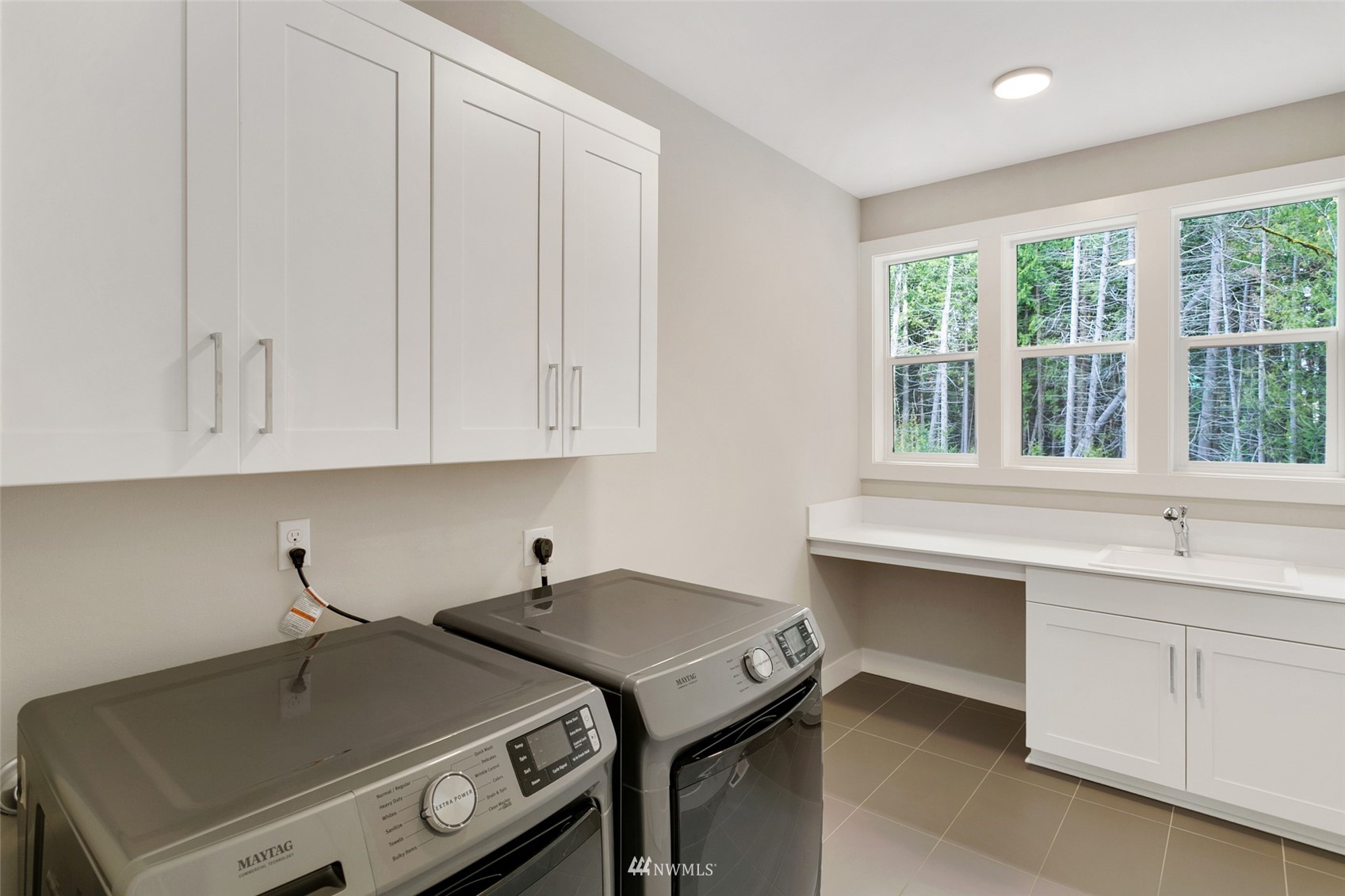 21899 Southeast 5th Place Sammamish, WA 98074 - Photo 19 of 35 a room with a sink and cabinets