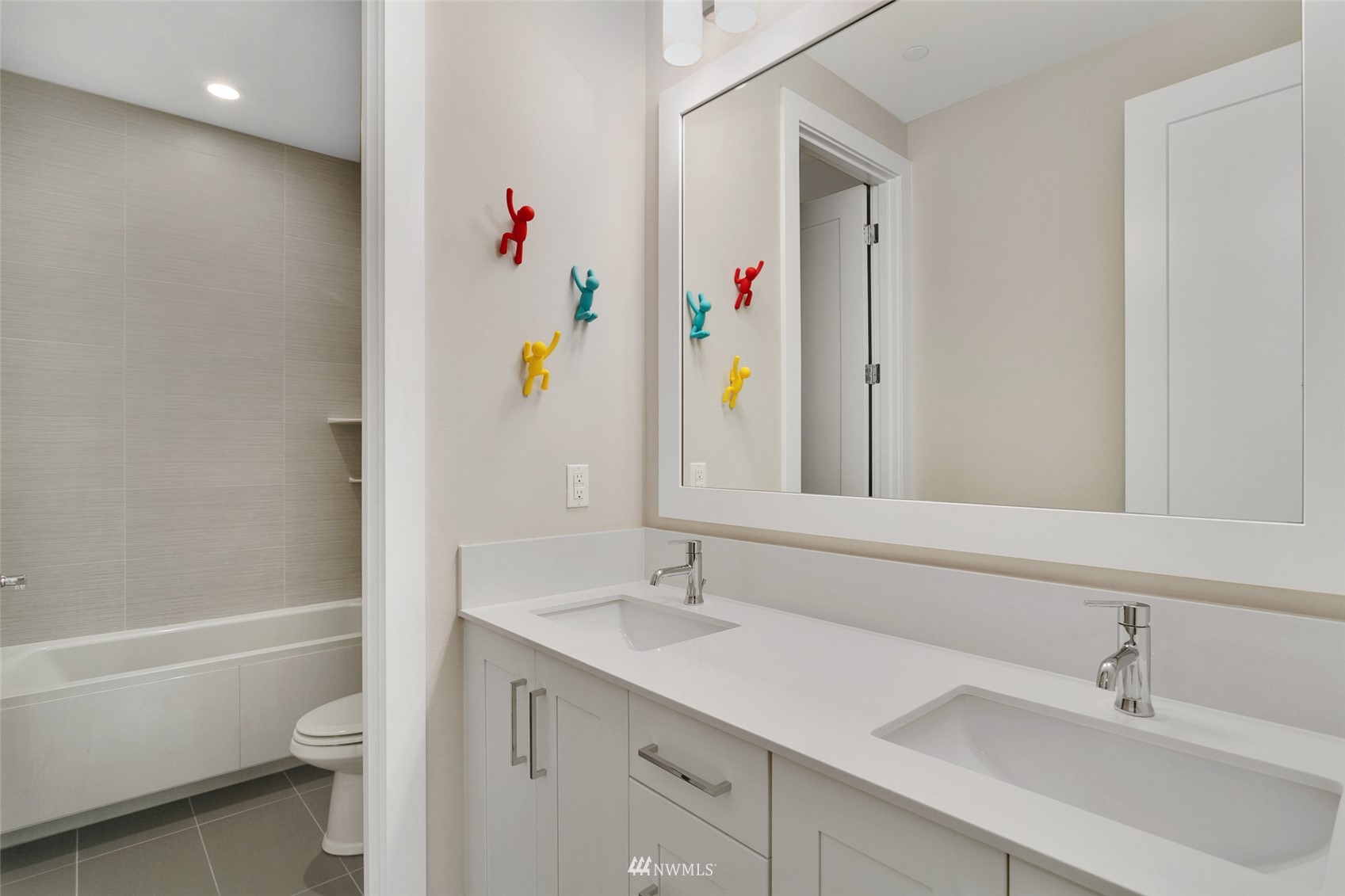 21899 Southeast 5th Place Sammamish, WA 98074 - Photo 20 of 35 a bathroom with a sink vanity mirror and toilet