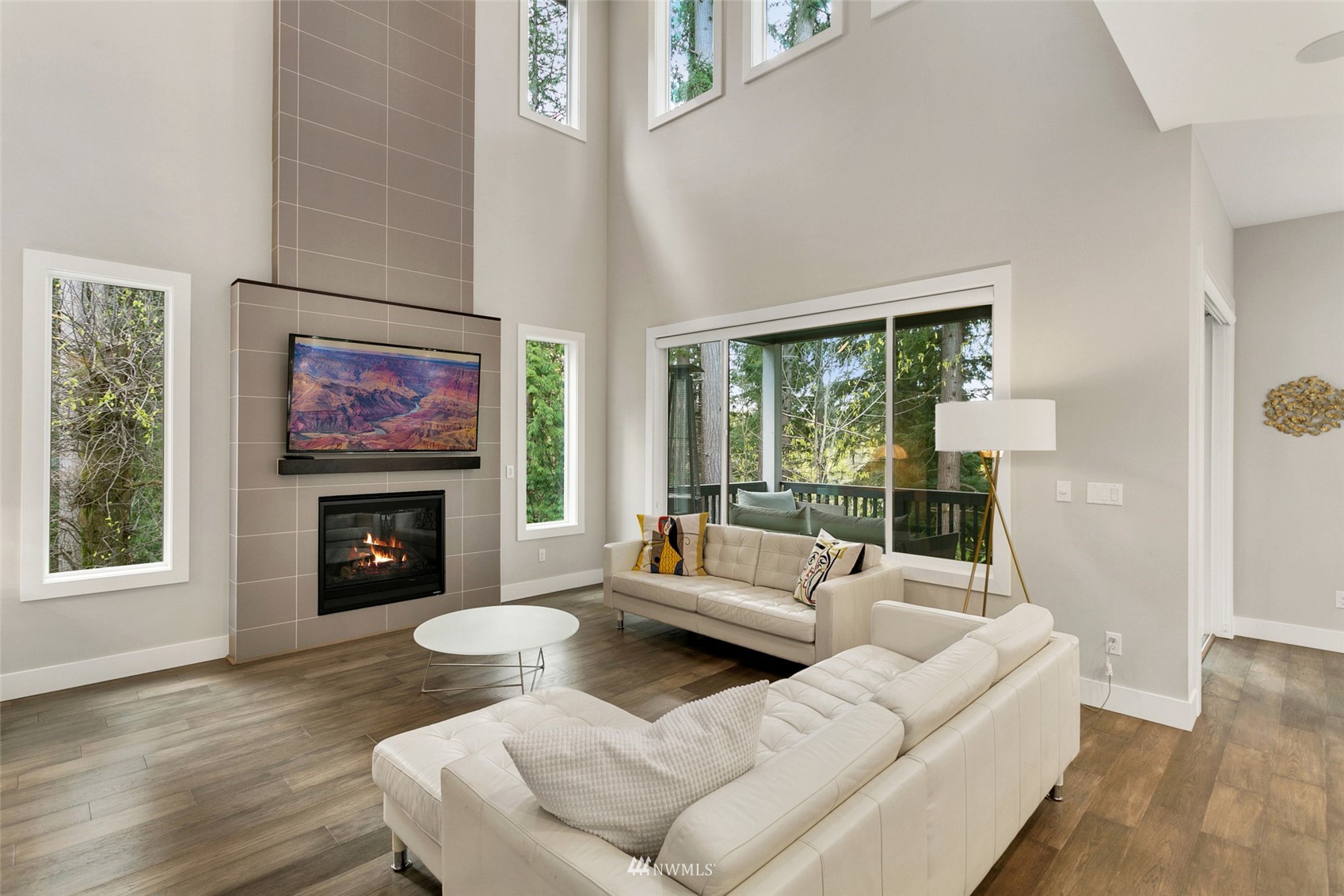 21899 Southeast 5th Place Sammamish, WA 98074 - Photo 2 of 35 a living room with furniture and a fireplace