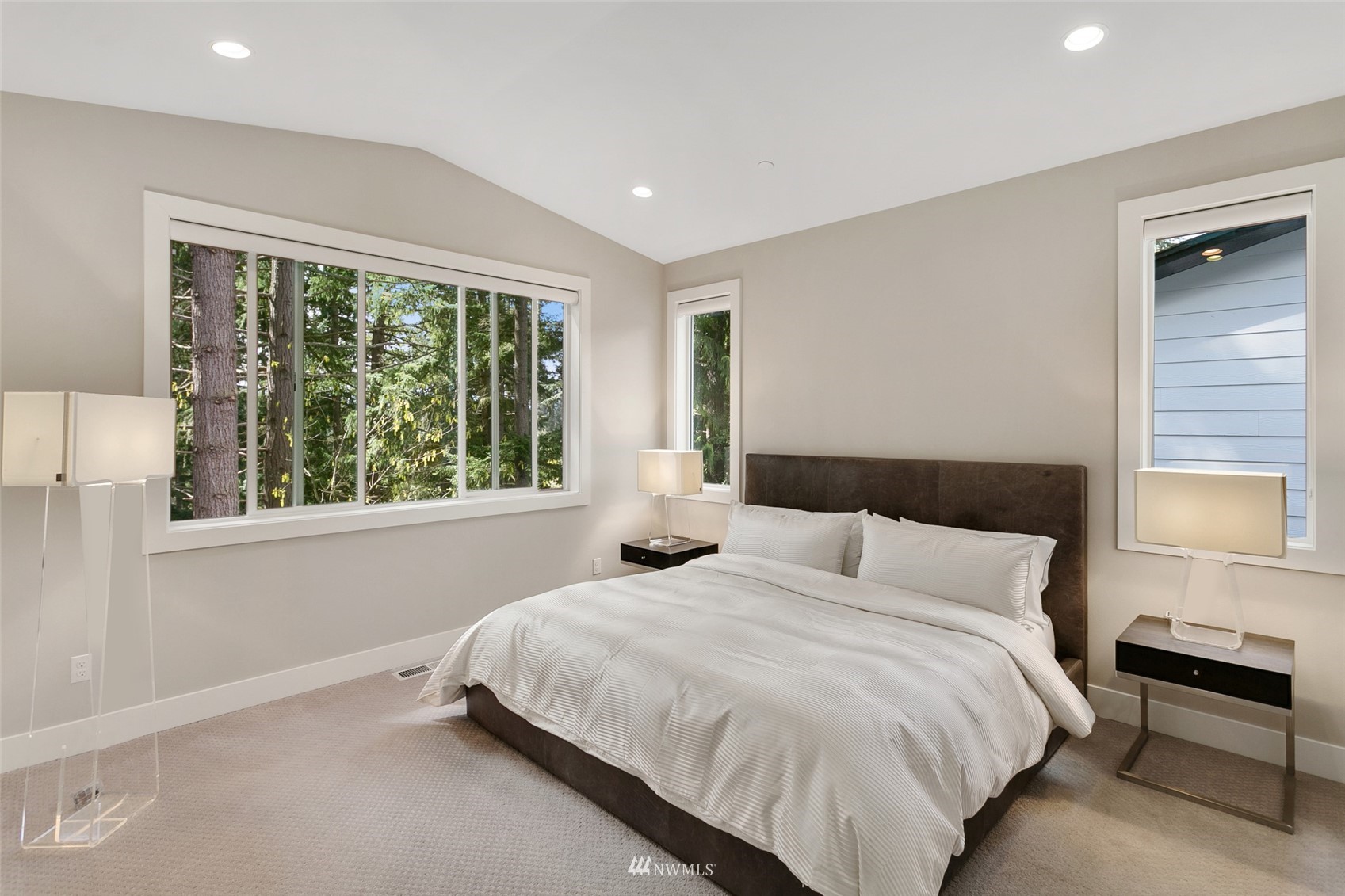 21899 Southeast 5th Place Sammamish, WA 98074 - Photo 22 of 35 a bedroom with a bed and a large window