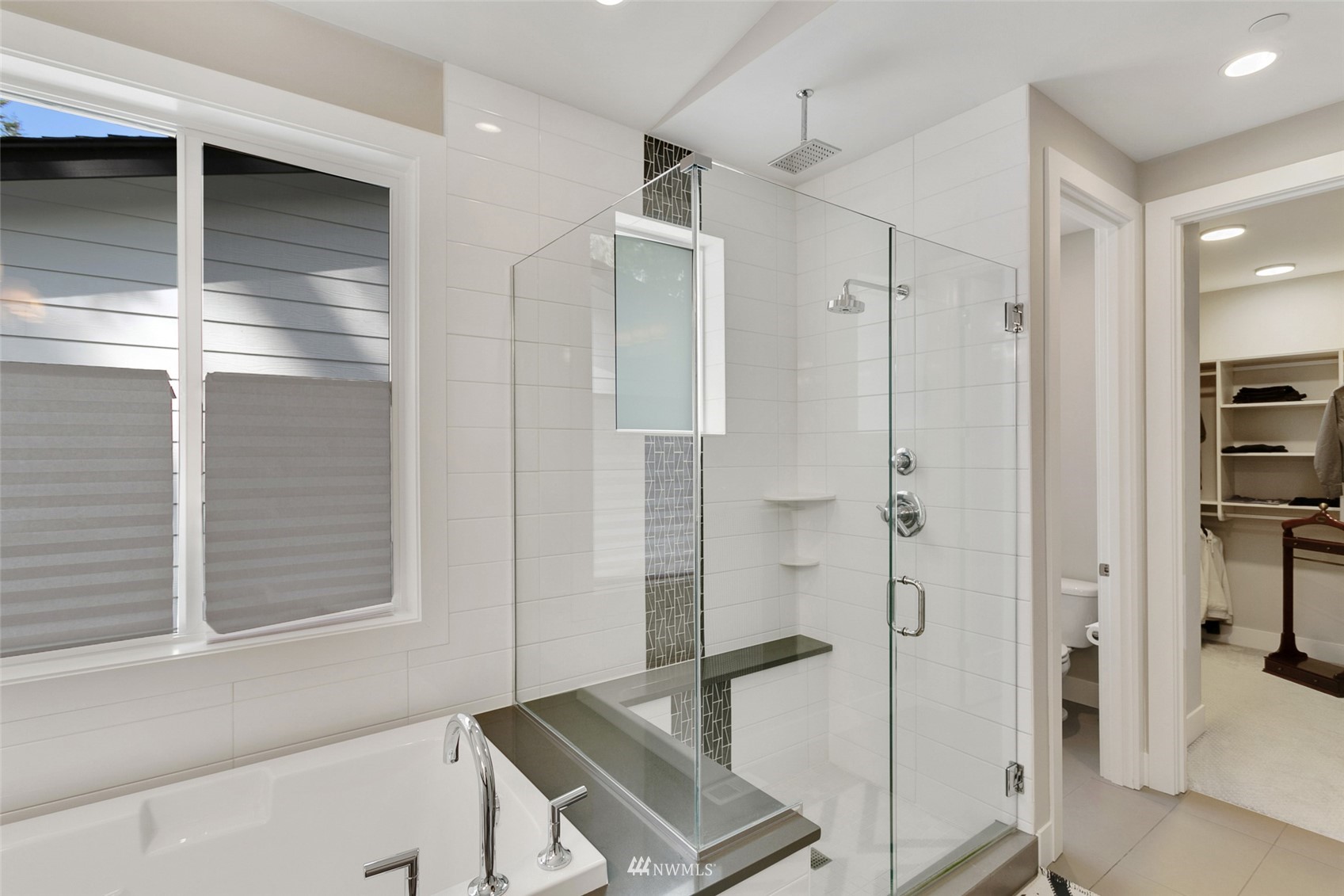 21899 Southeast 5th Place Sammamish, WA 98074 - Photo 24 of 35 a bathroom with a shower and a sink