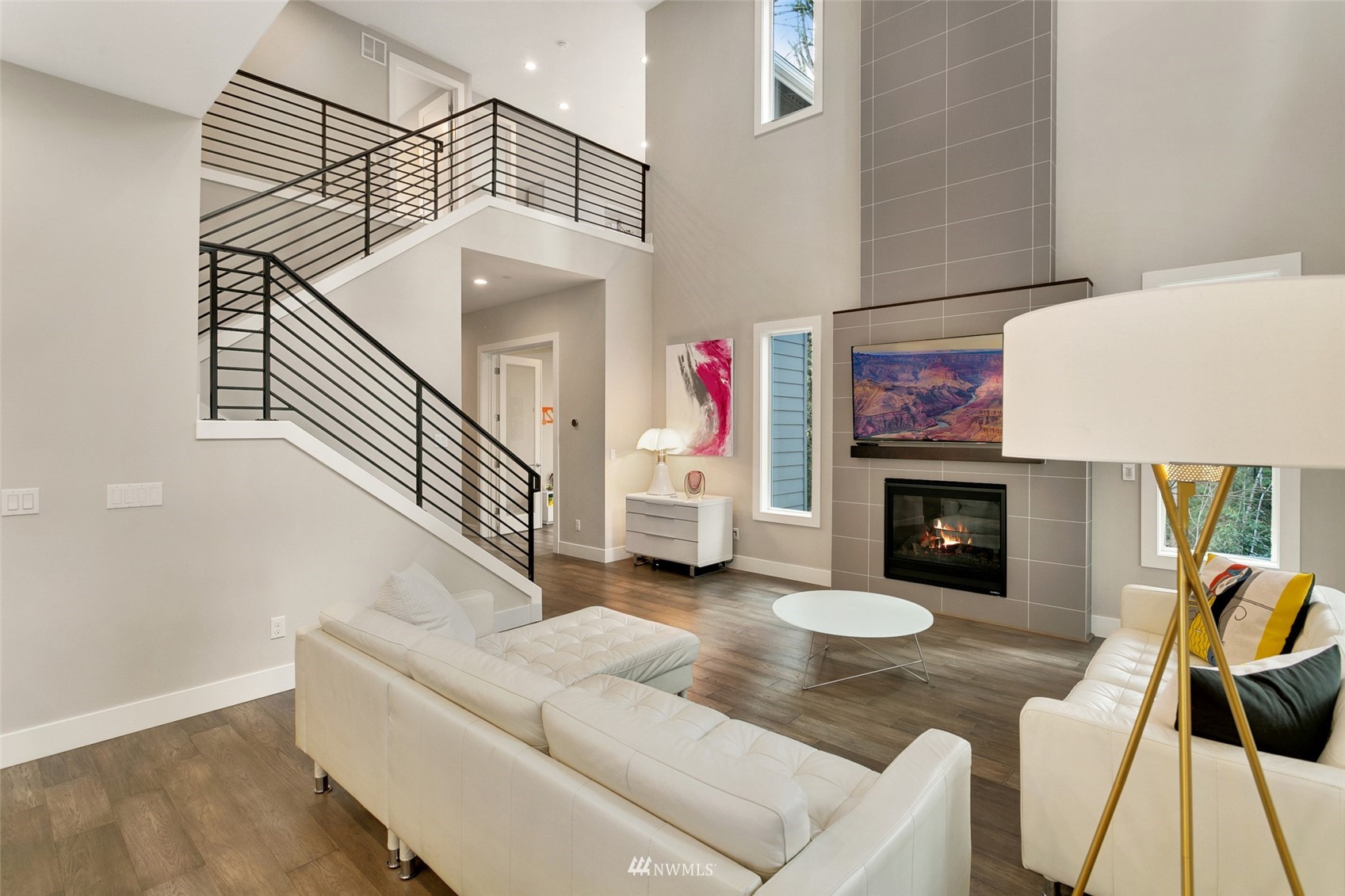 21899 Southeast 5th Place Sammamish, WA 98074 - Photo 3 of 35 a living room with furniture and a fireplace