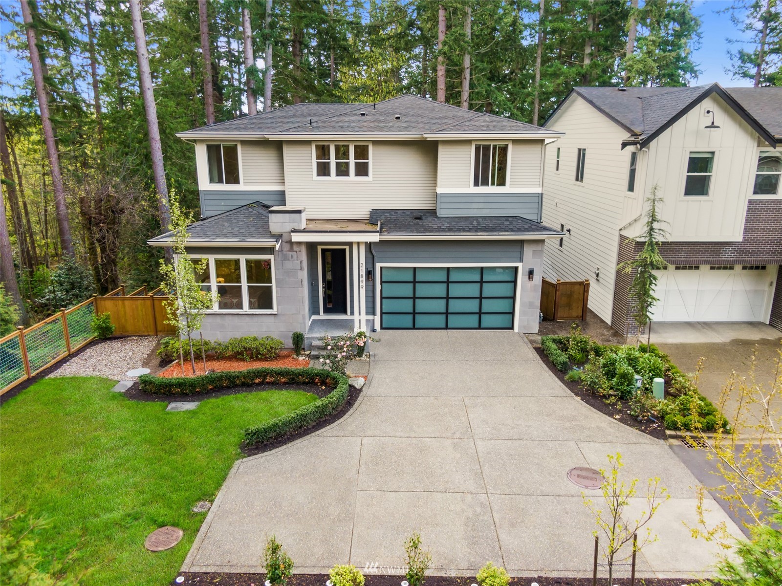 21899 Southeast 5th Place Sammamish, WA 98074 - Photo 31 of 35 a front view of a house with a yard and garage