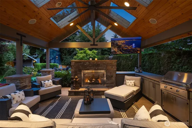a outdoor living space with patio furniture and a fireplace
