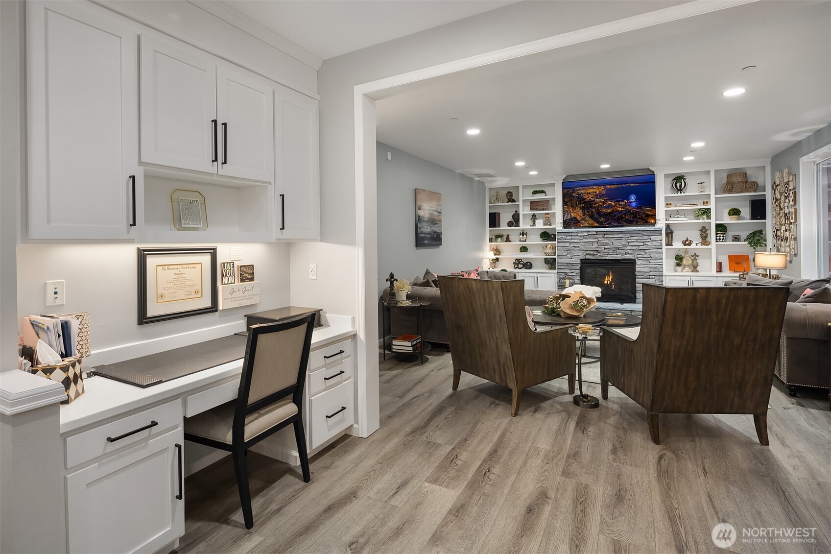 8907 Northeast 152nd Place Bothell, WA 98011 - Photo 16 of 39 a living room with furniture a flat screen tv and kitchen view
