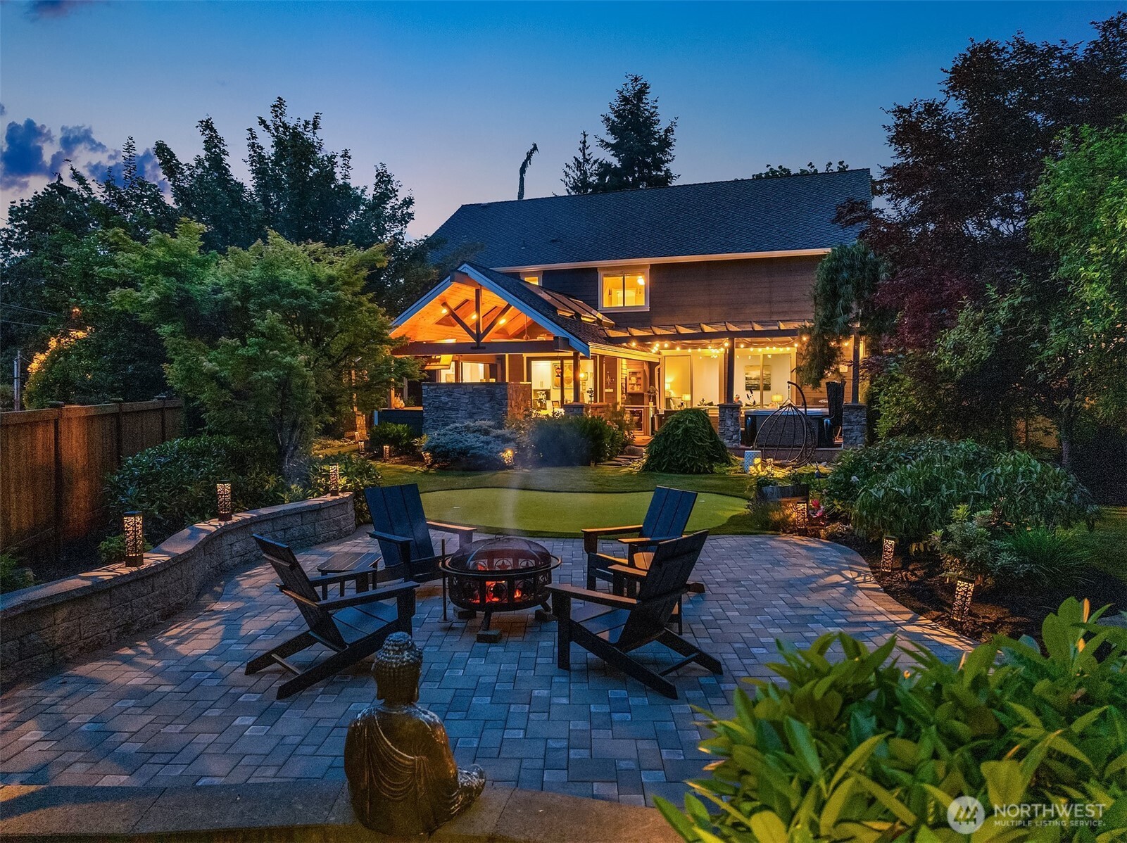8907 Northeast 152nd Place Bothell, WA 98011 - Photo 2 of 39 an outdoor sitting area with furniture and garden view