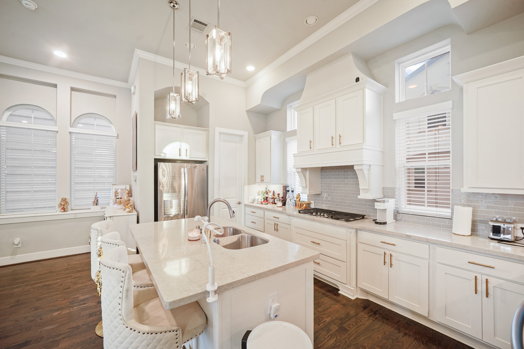 606 North Nagle Street Houston, TX 77003 - Photo 2 of 13 a kitchen with a sink stove a dining table and chairs