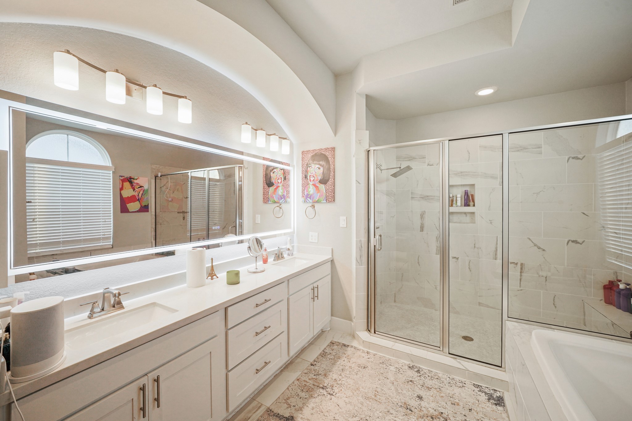 606 North Nagle Street Houston, TX 77003 - Photo 7 of 13 a bathroom with a double vanity sink mirror double and shower