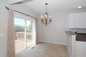 10049 Cummings Street Huntley, IL 60142 - Photo 12 of 30 a view of a room with a chandelier