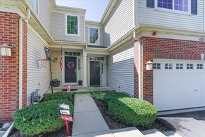 10049 Cummings Street Huntley, IL 60142 - Photo 2 of 30 a view of a house with potted plants