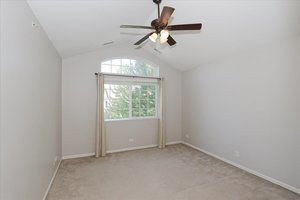 10049 Cummings Street Huntley, IL 60142 - Photo 21 of 30 an empty room with a ceiling fan and window