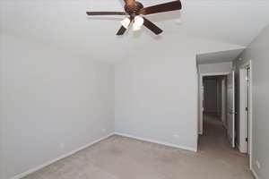 10049 Cummings Street Huntley, IL 60142 - Photo 22 of 30 an empty room with closet and a chandelier fan