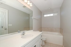 10049 Cummings Street Huntley, IL 60142 - Photo 23 of 30 a bathroom with a sink a toilet and shower