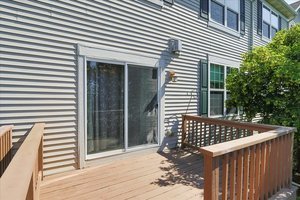 10049 Cummings Street Huntley, IL 60142 - Photo 29 of 30 a view of a wooden deck with a dining space