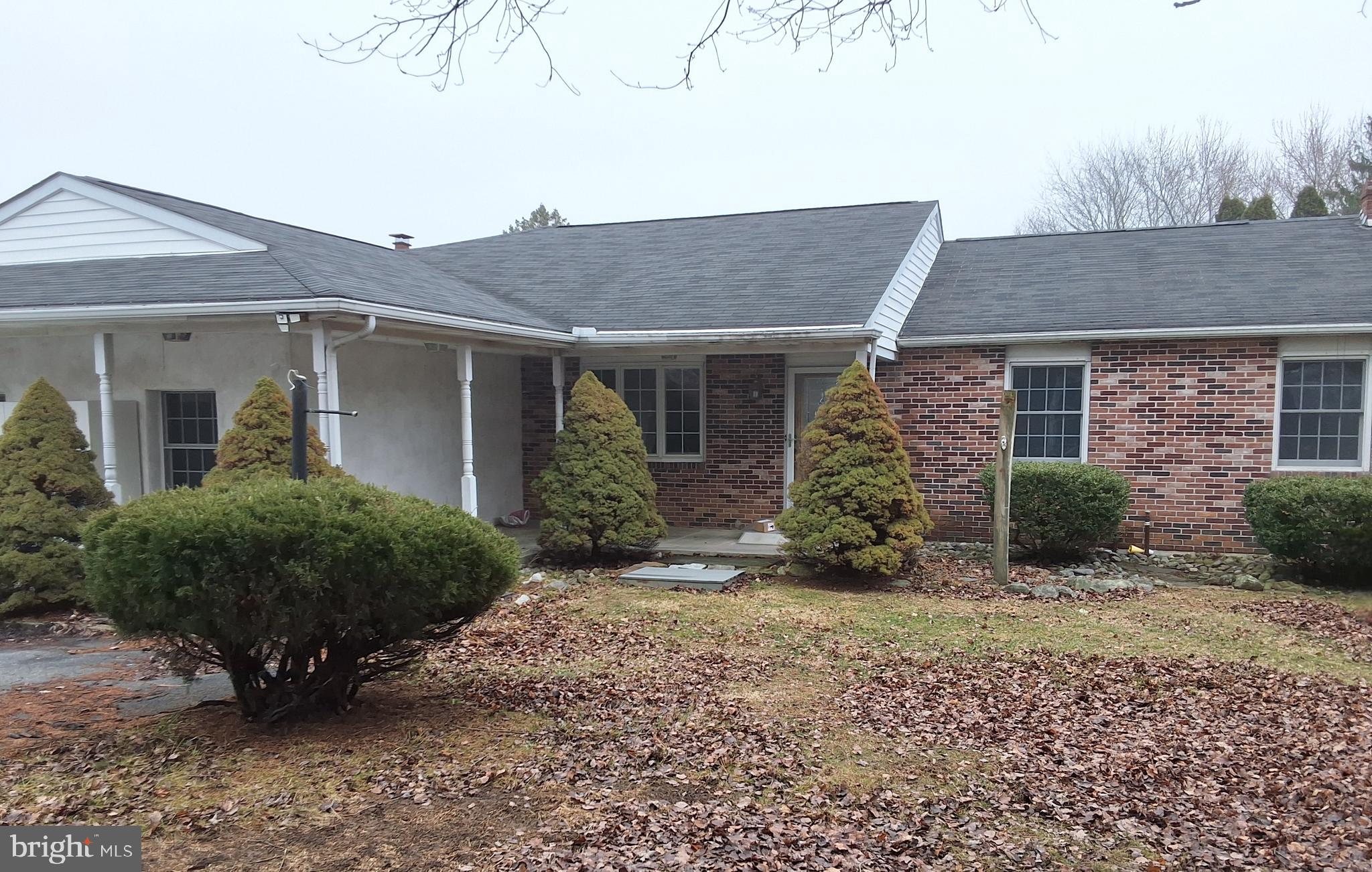 312 North Sandy Hill Road Coatesville, PA 19320 - Photo 2 of 23 a view of a house with a yard and potted plants