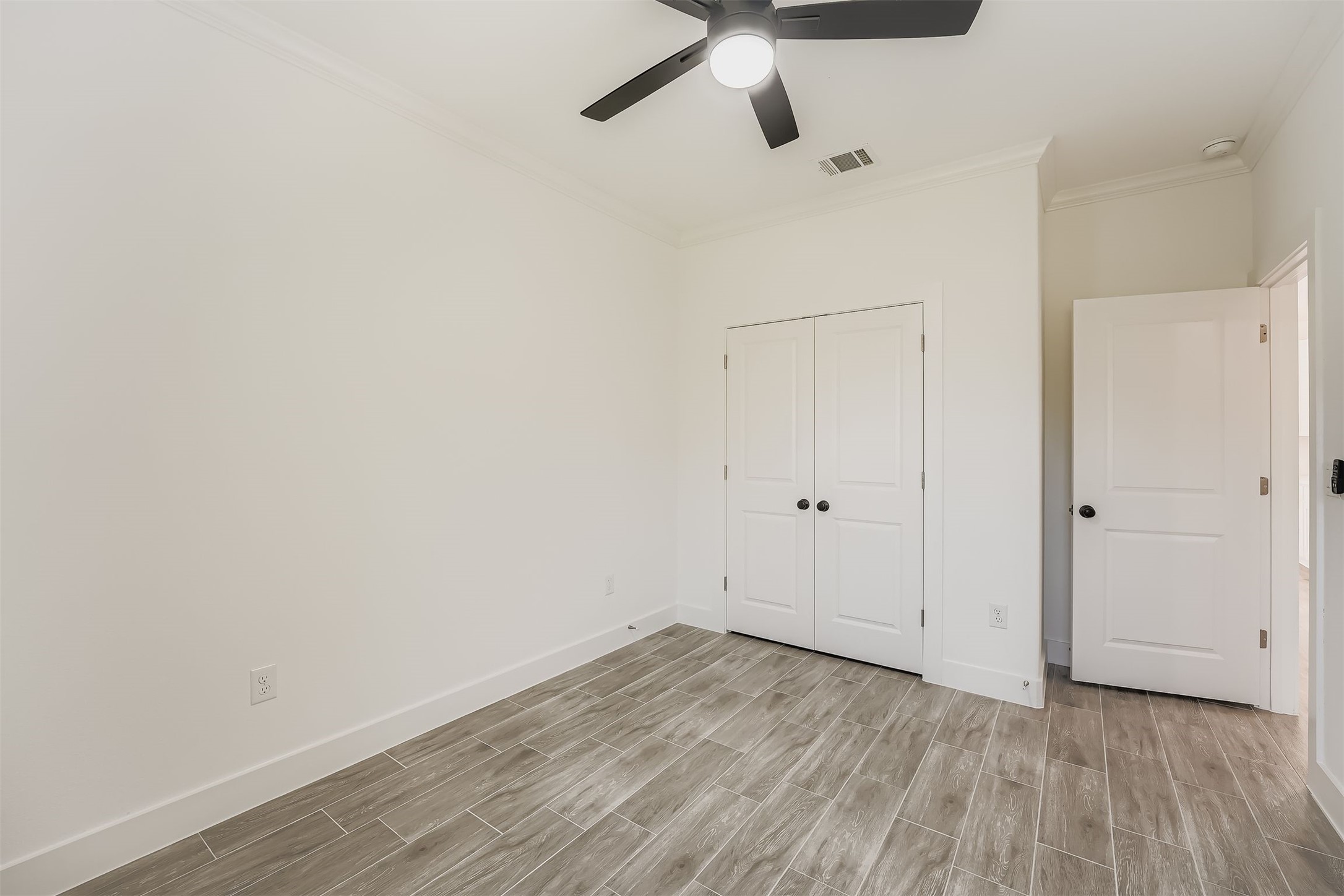 701 East 3rd Street Elgin, TX 78621 - Photo 20 of 28 a view of a room with wooden floor