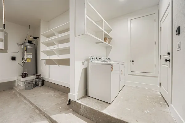 a view of a storage & utility room with closet dryer