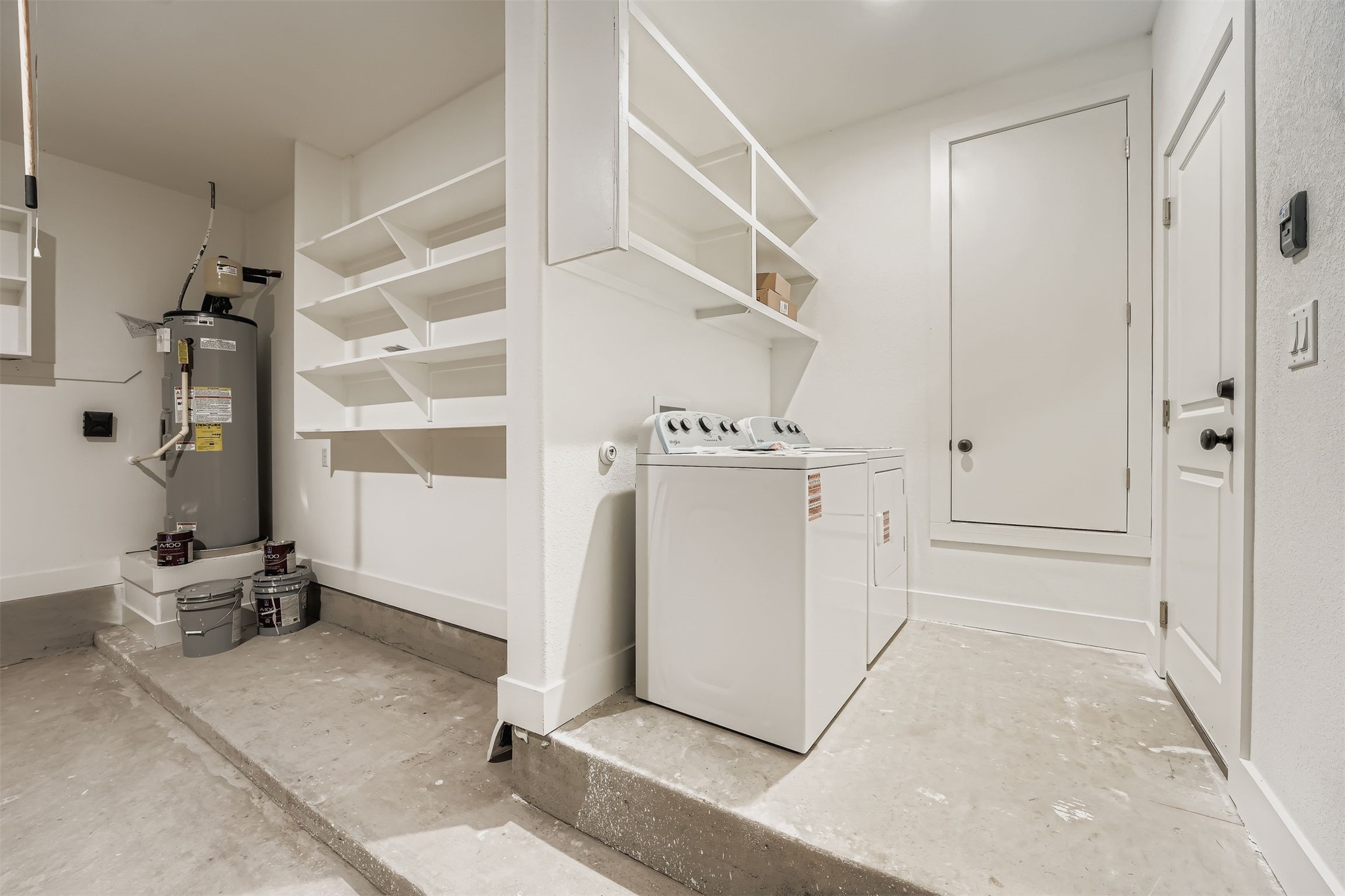 701 East 3rd Street Elgin, TX 78621 - Photo 23 of 28 a view of a storage & utility room with closet dryer