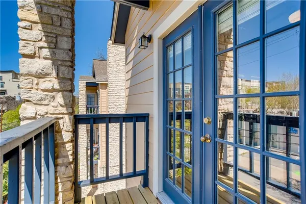 a view of a brick building from a balcony