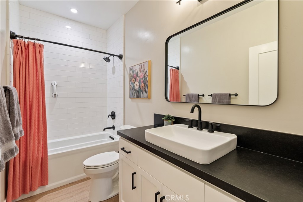 8550 El Corte Road Atascadero, CA 93422 - Photo 36 of 72 a bathroom with a sink a toilet and shower a mirror