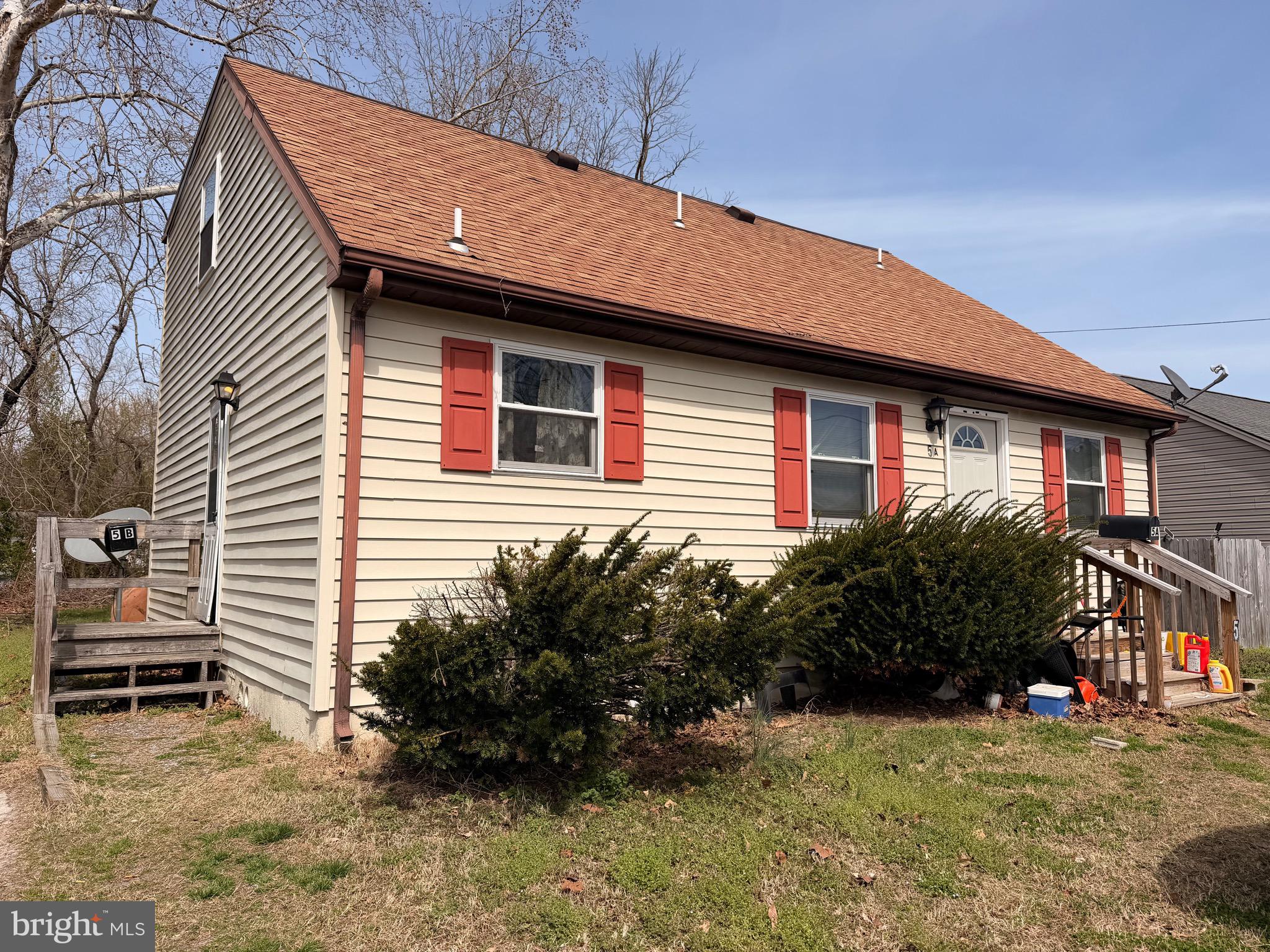 5 West Chestnut Street Delmar, MD 21875 - Photo 1 of 28 a front view of a house with garden