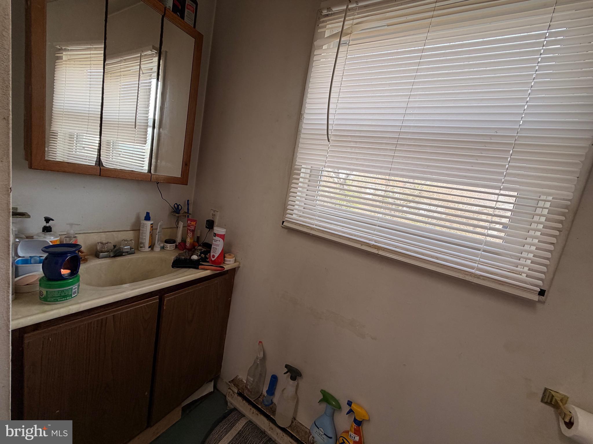 5 West Chestnut Street Delmar, MD 21875 - Photo 12 of 28 a kitchen with a sink cabinets and a window