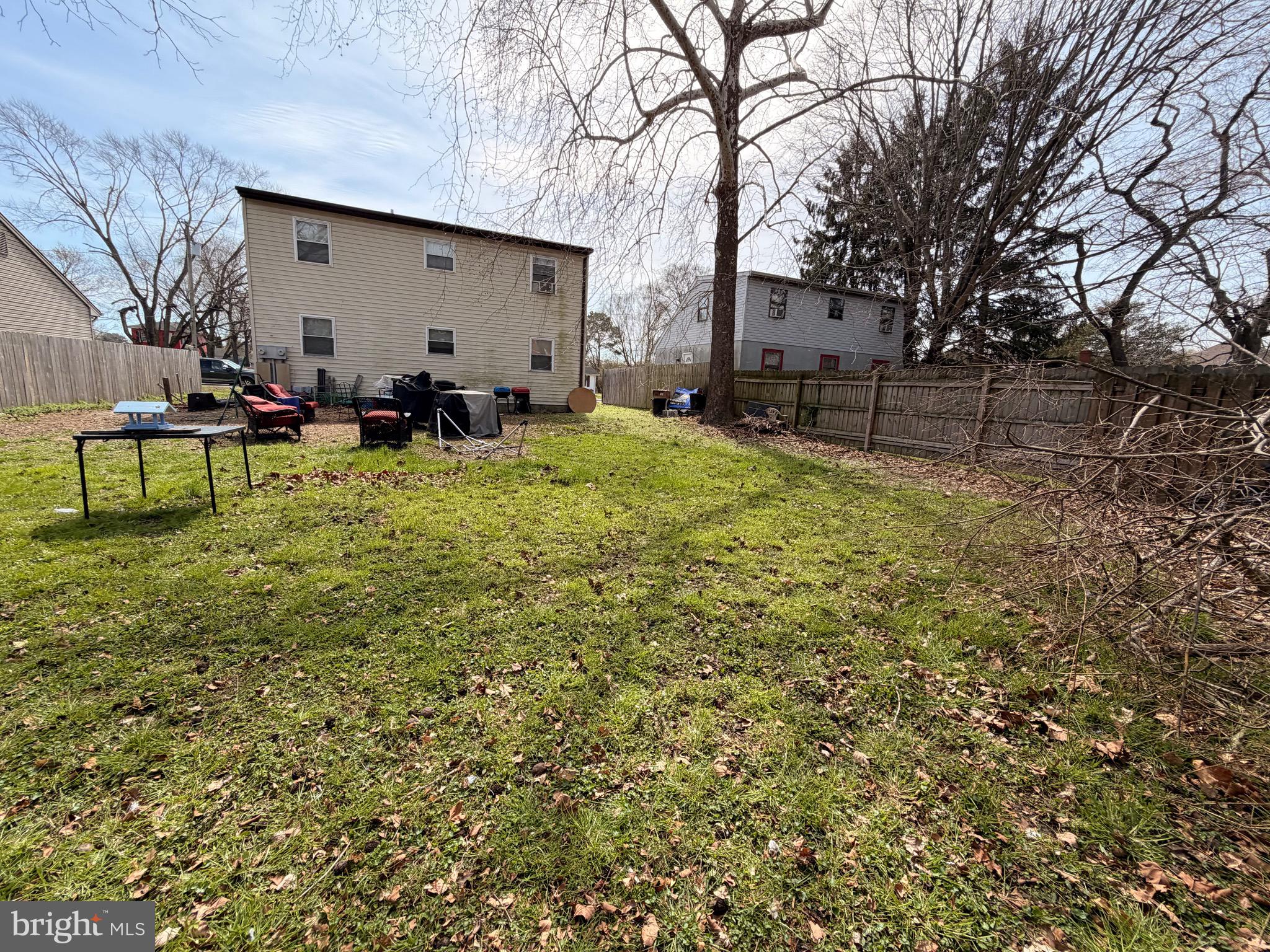5 West Chestnut Street Delmar, MD 21875 - Photo 24 of 28 a backyard of a house with table and chairs