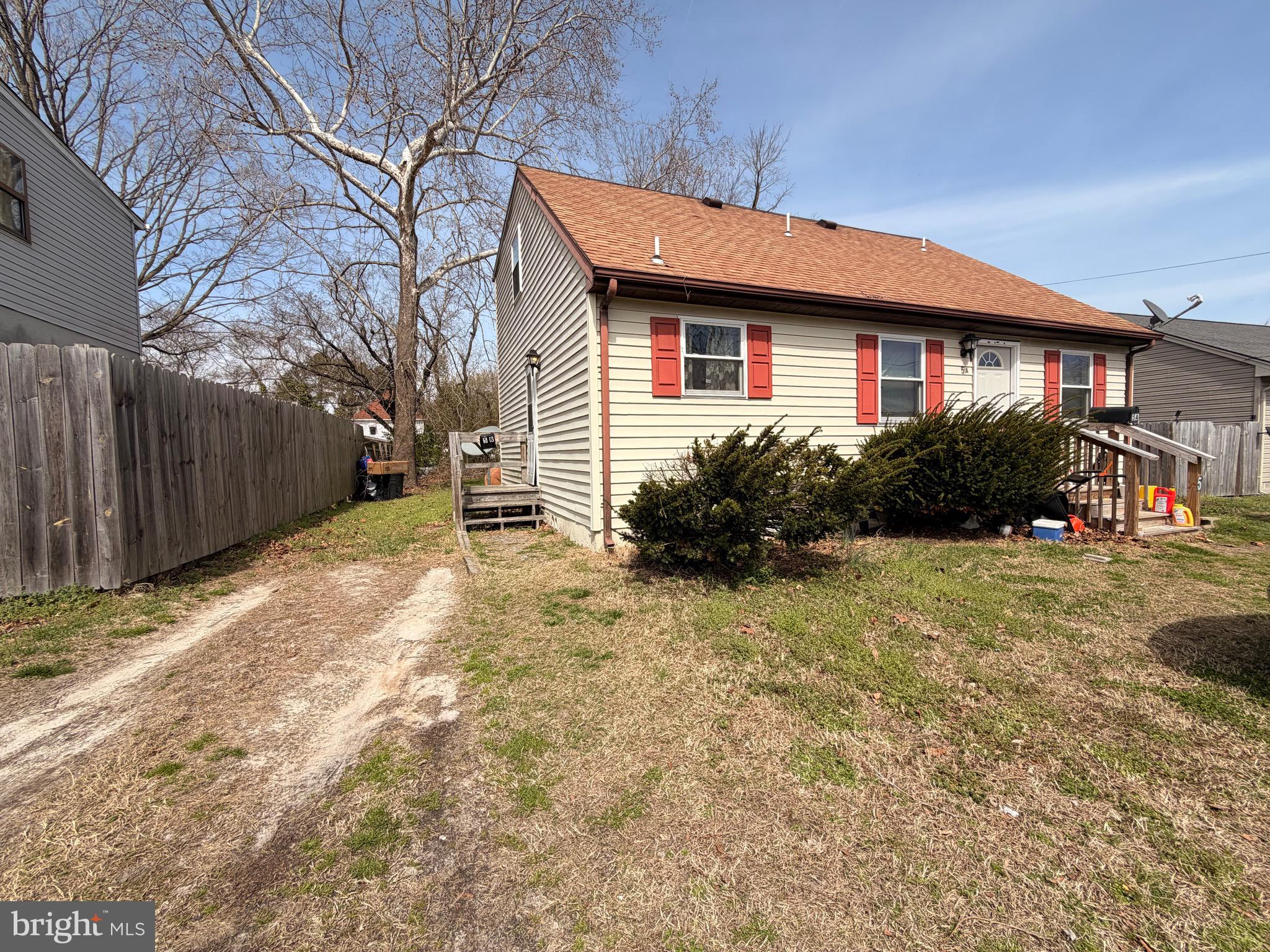 5 West Chestnut Street Delmar, MD 21875 - Photo 3 of 28 a front view of a house with garden