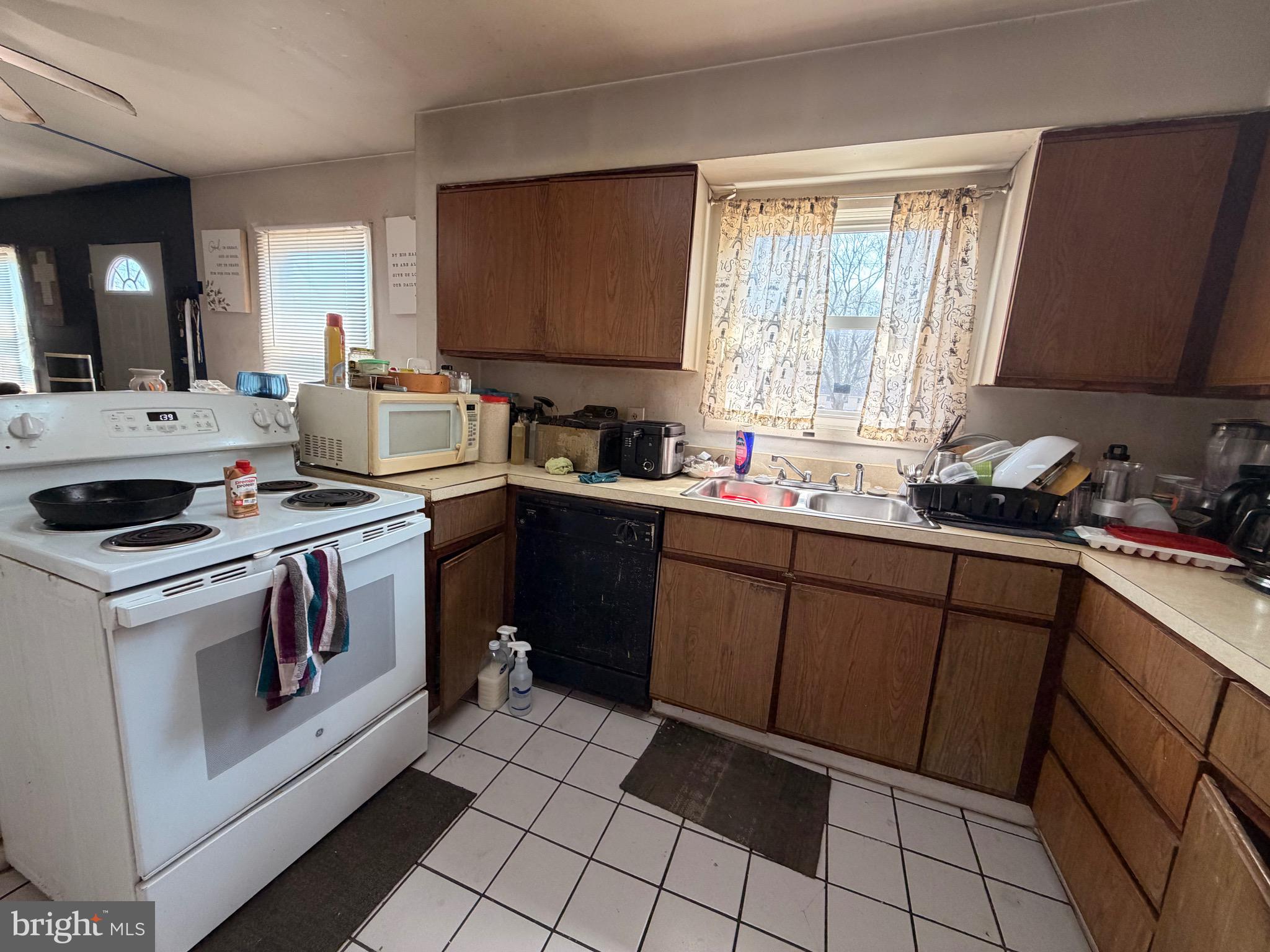5 West Chestnut Street Delmar, MD 21875 - Photo 4 of 28 a kitchen with a sink stove and cabinets