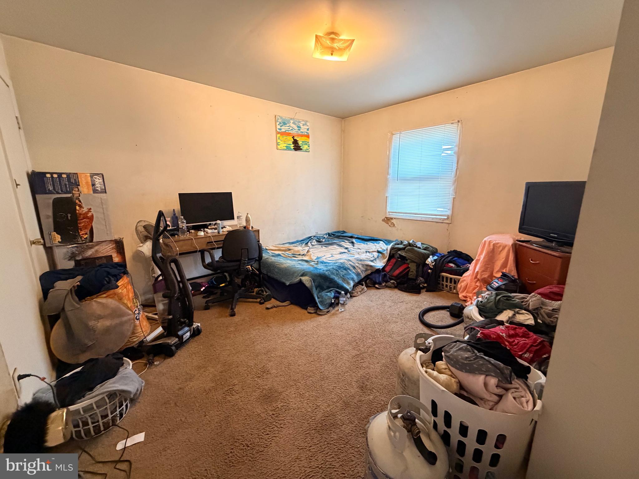5 West Chestnut Street Delmar, MD 21875 - Photo 8 of 28 a room with gym equipment and a flat screen tv