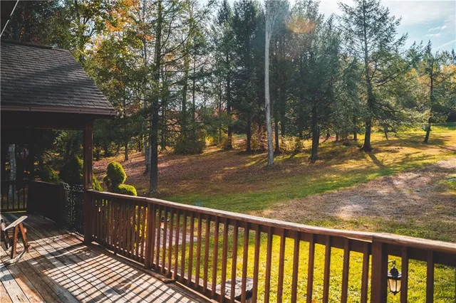 a view of a pathway with a wrought fence