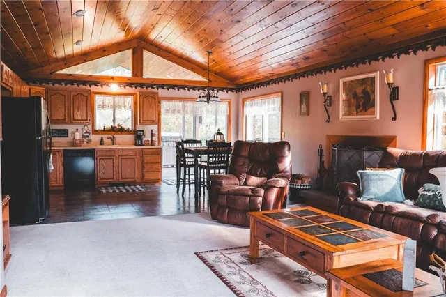 a living room with furniture a table and chairs