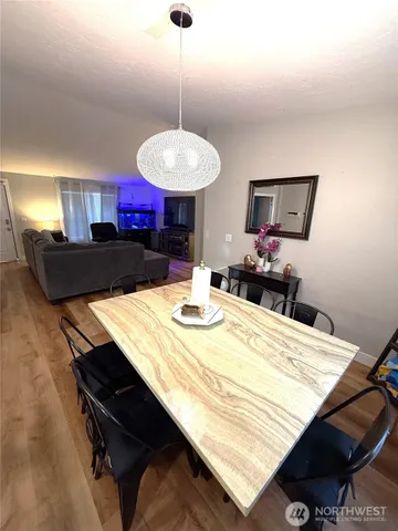 a kitchen with a table and chairs