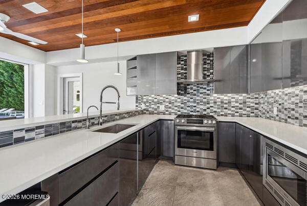 54 Georgetown Road Eatontown, NJ 07724 - Photo 20 of 24 a kitchen with stainless steel appliances a sink stove and cabinets