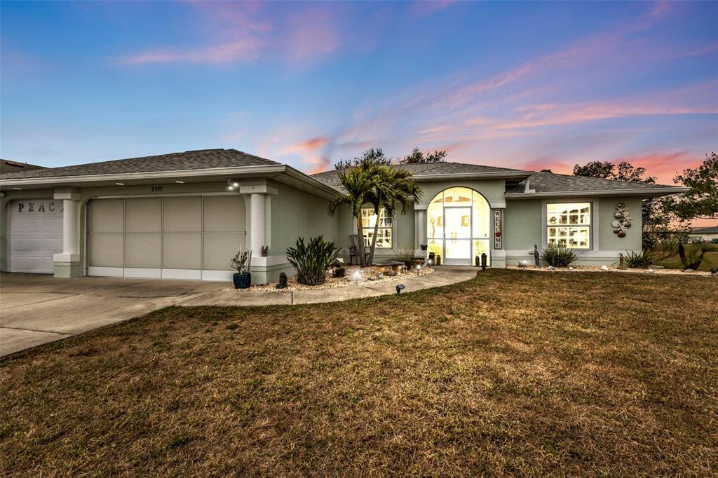2577 Mauritania Road Punta Gorda, FL 33983 - Photo 1 of 1 a front view of a house with a yard