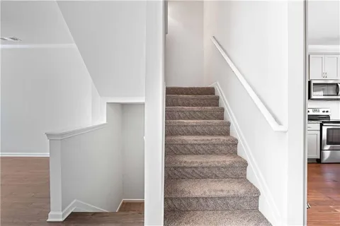 a view of staircase with white walls and white walls