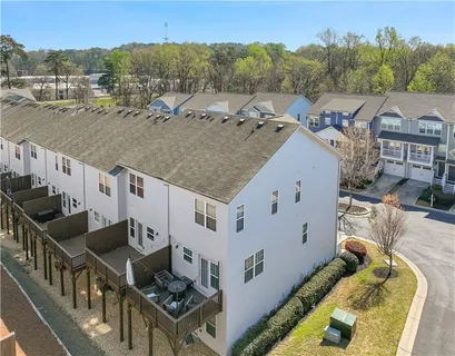 an aerial view of a house with garden space and sitting space