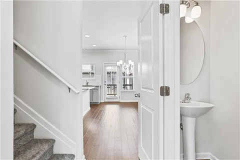 a view of an entryway with wooden floor