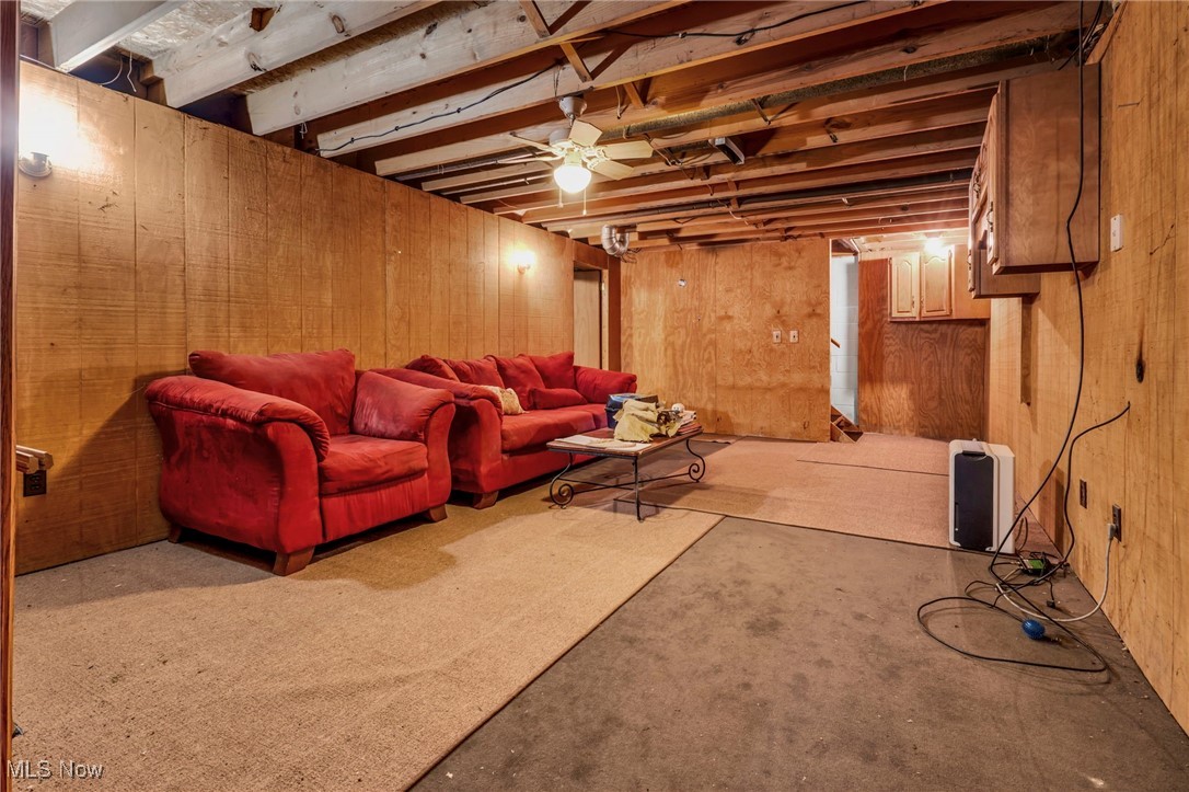 1648 Cassell Road Butler, OH 44822 - Photo 15 of 36 Basement featuring light carpet and wooden walls