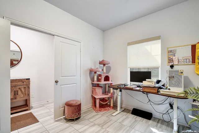 a workspace with furniture and a window