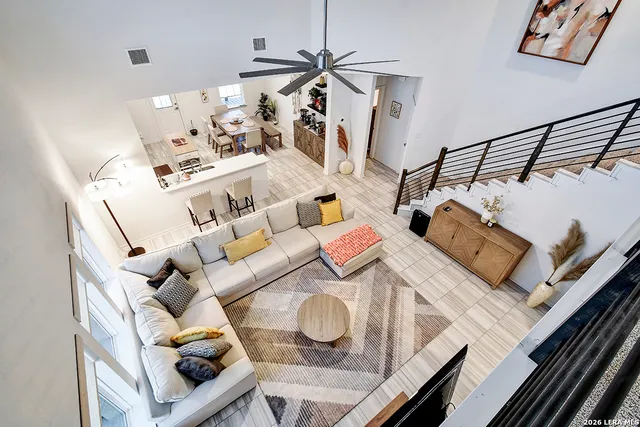 a view of living room with furniture and wooden floor
