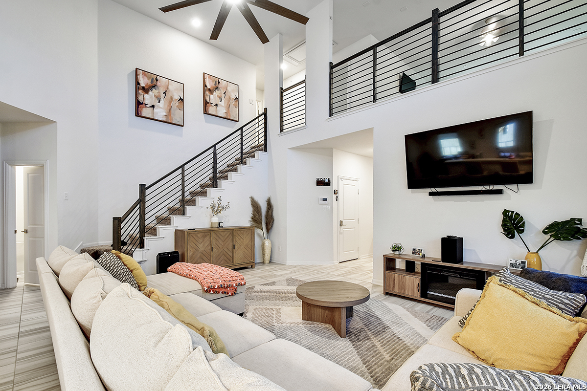 8863 Grey Elm Elmendorf, TX 78112 - Photo 3 of 35 a living room with furniture and a flat screen tv